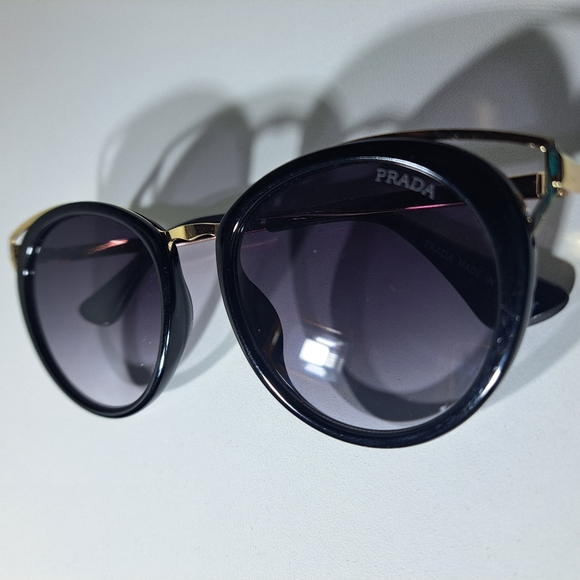 Prada Black Frame Sunglasses with Gold Temple Accents - Picture 9 of 12